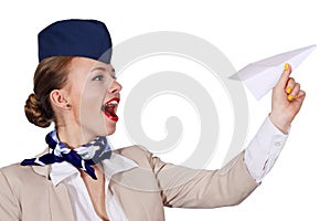 Air hostess holding a paper airplane