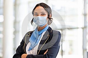 Air hostess wearing face mask during virus pandemic