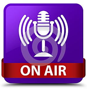 On air (mic icon) purple square button red ribbon in middle