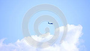 Air plane clouds and blue sunny sky, Loop of white clouds over blue sky with sun Rays, Aerial view, drone shooting