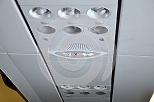 Air plane interior signs on overheaad panel
