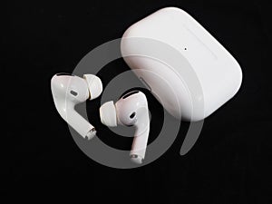 Air Pods Pro. with Wireless Charging Case. New Airpods pro on black background. photo