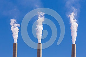 Air pollution from coal-powered plant smoke stacks photo