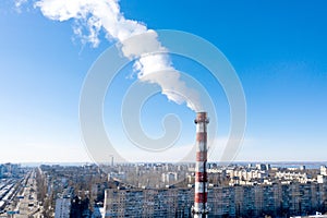 Air pollution, factory pipes, smoke from chimneys on sky background. Concept of industry, ecology, steam plant, heating season,