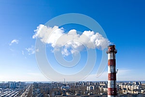 Air pollution, factory pipes, smoke from chimneys on sky background. Concept of industry, ecology, steam plant, heating season,