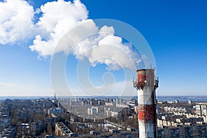 Air pollution, factory pipes, smoke from chimneys on sky background. Concept of industry, ecology, steam plant, heating season,