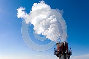 Air pollution, factory pipes, smoke from chimneys on sky background. Concept of industry, ecology, steam plant, heating season,