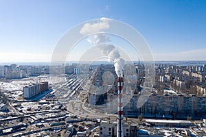 Air pollution, factory pipes, smoke from chimneys on sky background. Concept of industry, ecology, steam plant, heating season,