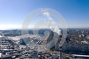 Air pollution, factory pipes, smoke from chimneys on sky background. Concept of industry, ecology, steam plant, heating season,