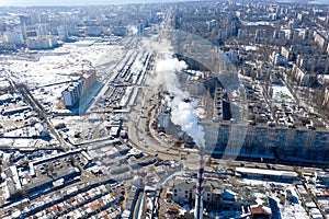 Air pollution, factory pipes, smoke from chimneys on sky background. Concept of industry, ecology, steam plant, heating season,