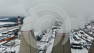 Air pollution. Power plant with smoke from chimneys. Drone shot.
