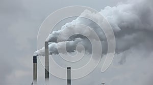 Air pollution by smoke coming out of factory chimneys, environmentally threatening smoke from chimneys