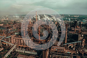 Air pollution by smoke from factory chimneys, aerial view. Industrial landscape from drone point of view