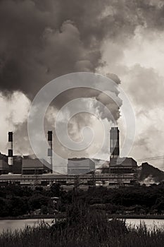 Air pollution smoke from factory chimneys dark scary sky vertical shot