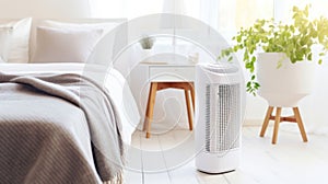 Air purifier in cozy white bedroom for filter and cleaning removing dust PM2.5 HEPA and virus in home