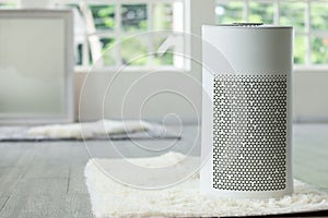 Air purifier in cozy white Living room for filter and cleaning removing dust PM2.5 HEPA in home