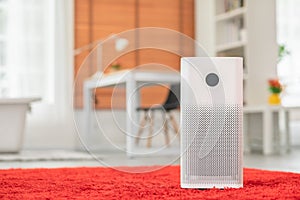 Air purifier in cozy white living room for filter and cleaning removing dust PM2.5 HEPA and virus in home,for fresh air and