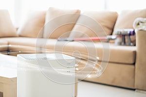 air purifier a living room  air cleaner removing fine dust in house. protect PM 2.5 dust and air pollution concept