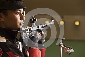 Air rifle shooter checking the time