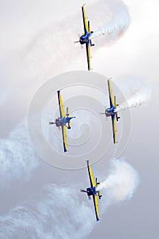 Air Show scene with stunt airplane of aerobatic team performing formation acrobatics