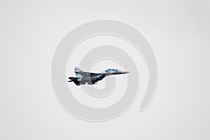 Air show in the sky above the Krasnodar airport flight school. Airshow in honor of Defender of the Fatherland. su-35 in the sky. photo