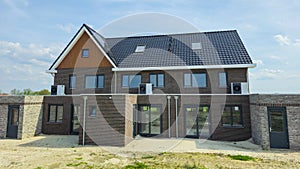 air source heat pump unit installed outdoors at a modern home with bricks in the Netherlands