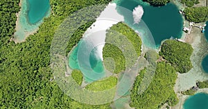 Air survey of lagoons and rainforest. Tinago Island.