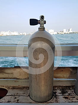 Air tank in a slot for SCUBA divers on the boat