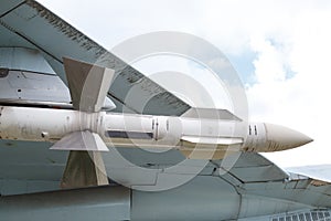 The air to air missile is suspended under the wing of the aircraft