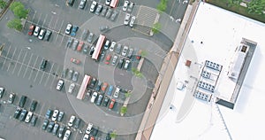 Air top view of on the parking lot for half empty on shopping mall the are cars on parking