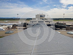 Air Traffic Control Tower at the Airport and airplanes parked Nearby