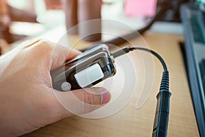 Air traffic controller& x27;s hand while holding to talk button