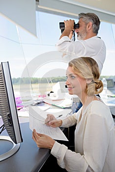 air traffic controllers at work in flight control tower