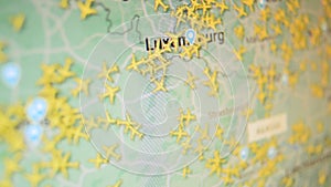 Air traffic London Luxembourg Europe cities airplane map. Camera shot computer screen