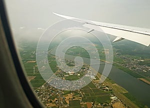 Air travel-airplane window view of landscape