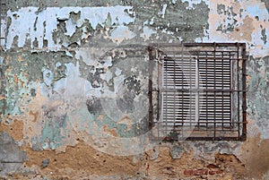 Air Ventilation on an old building wall with rusty iron bars