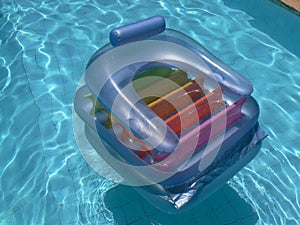 Airbed in swimming pool photo