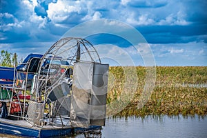 airboat in the everglades of Florida with grass and wetland swamp in the background