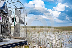 airboat in the everglades of Florida with grass and wetland swamp in the background