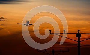 Airbus 320 silhouette on sunset landing on airport