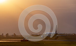 Airbus 320 silhouette on sunset landing on airport closeup