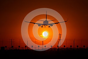 Airbus A320 airplane silhouette at sunset , final approach closeup