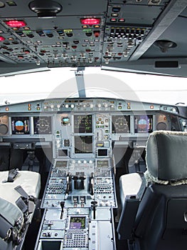 Airbus A330 airplane's cockpit with front, overhead and pedestrian panel