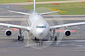 Airbus A340 airliner taxiing on platform of an airport photo