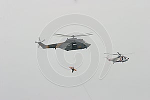 Airbus Superpuma and US Sikorsky helicopters rescue maneuvers inflight