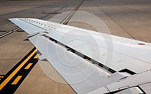 Aircraft airplane left wing on airport soil signs