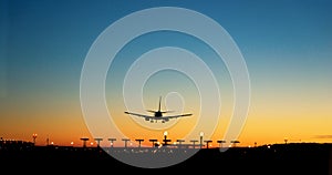 Aircraft approaching airport at sunset