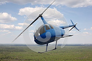 Aircraft - Blue Helicopter flight sky and clouds background