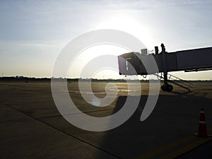 Aircraft bridge and plane pit at sunset