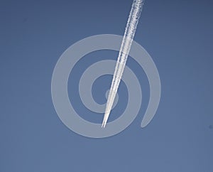 Aircraft with chem trails photo